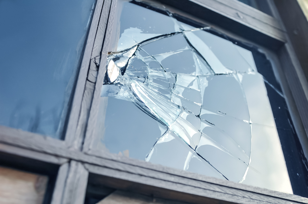Broken,Glass,Window,Reflecting,Blue,Sky